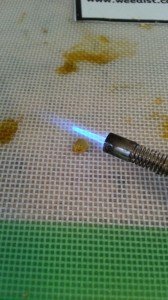 Hold a flame over the wax for just a few seconds....